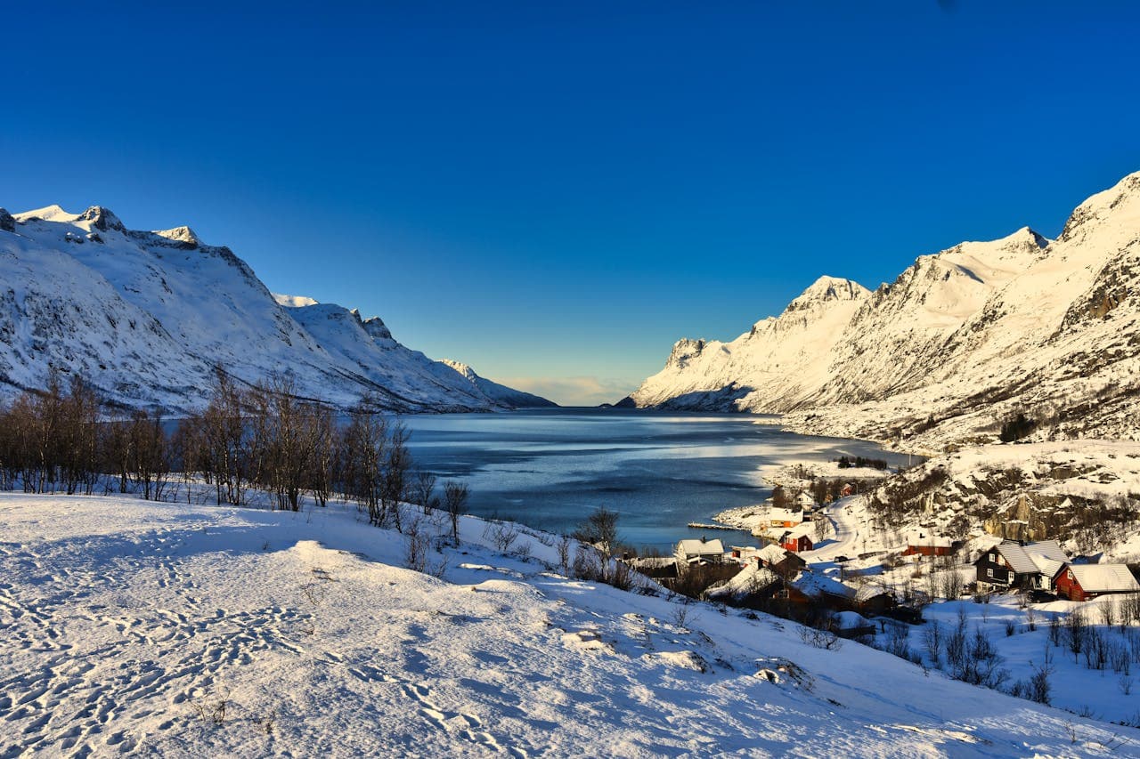 Norwegian fjord with snow-capped mountains